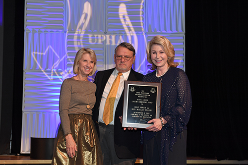 Grace Arnold and her sister Lauren Gurton accepted the Alvin C. Ruxer Lifetime Commitment Award on behalf of Grace and their mother, Mary McLellan Williams. Photo by Howard Schatzberg.