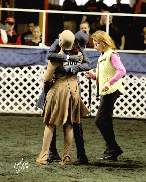 Faye Wuesthofen and Ellen Medley Wright hug each other before switching horses during the USEF Medal Finals in 2009.