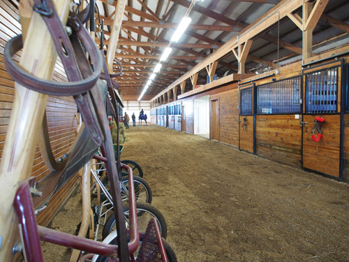 Mike Roberts Stable is built like one giant indoor arena, with a lounge, tack room and stalls in the center and down one long side.