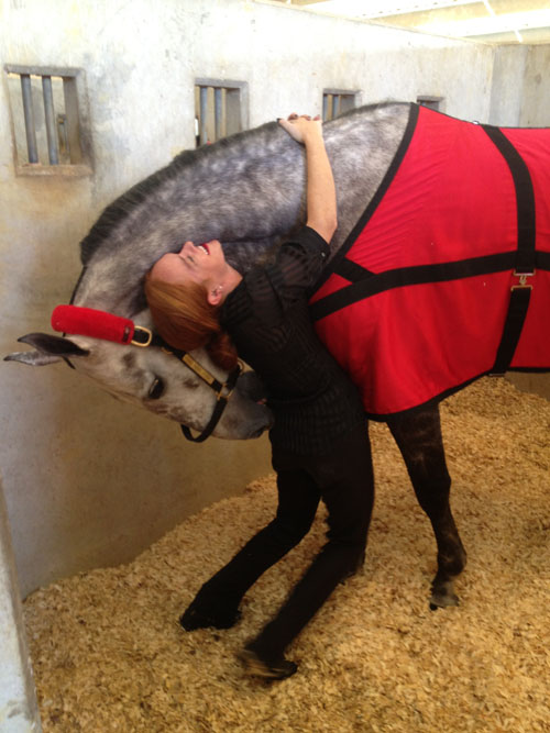 Ali goofs around with her hunter horse Jolly Mon Sing.