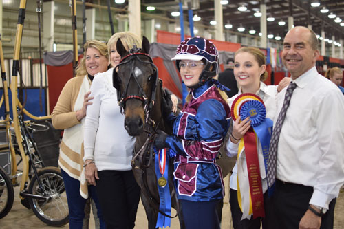 Emma Wood drove Sirfistication to the AHHS Youth Medallion Road Pony 14 17 Finals and celebrated with her Rowdy Lowrys crew