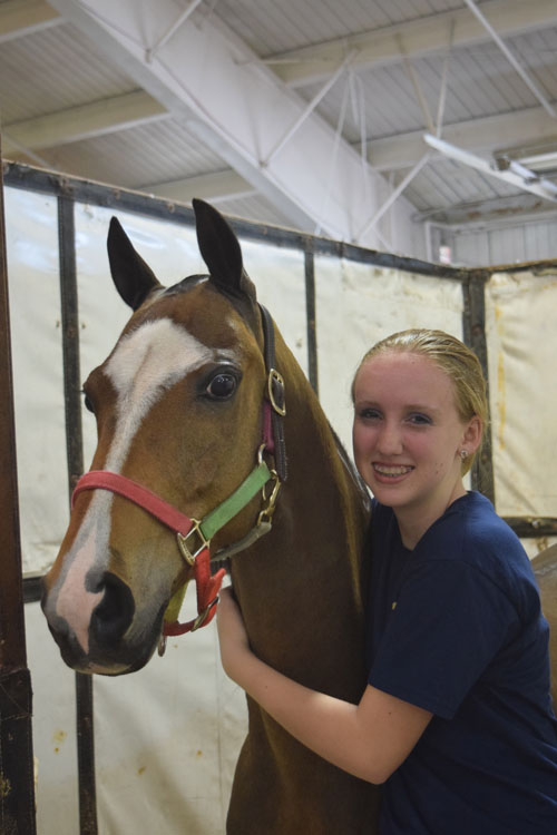 Makenzie Moore hugged Hightower after winning the AHHS Youth Medallion Road Pony Under Saddle class. This team also went on to win the championship.