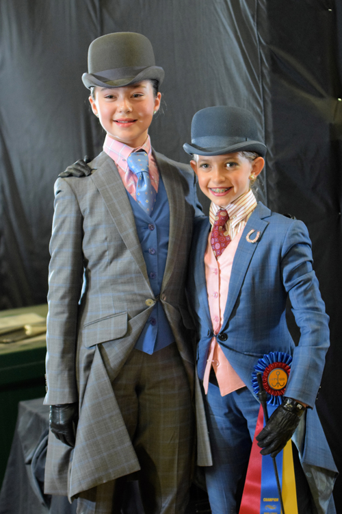 Gracie Weissman and Kennedy Wisdom demonstrate good sportsmanship after the Walk/Trot Equitation Championship at Bridlespur.