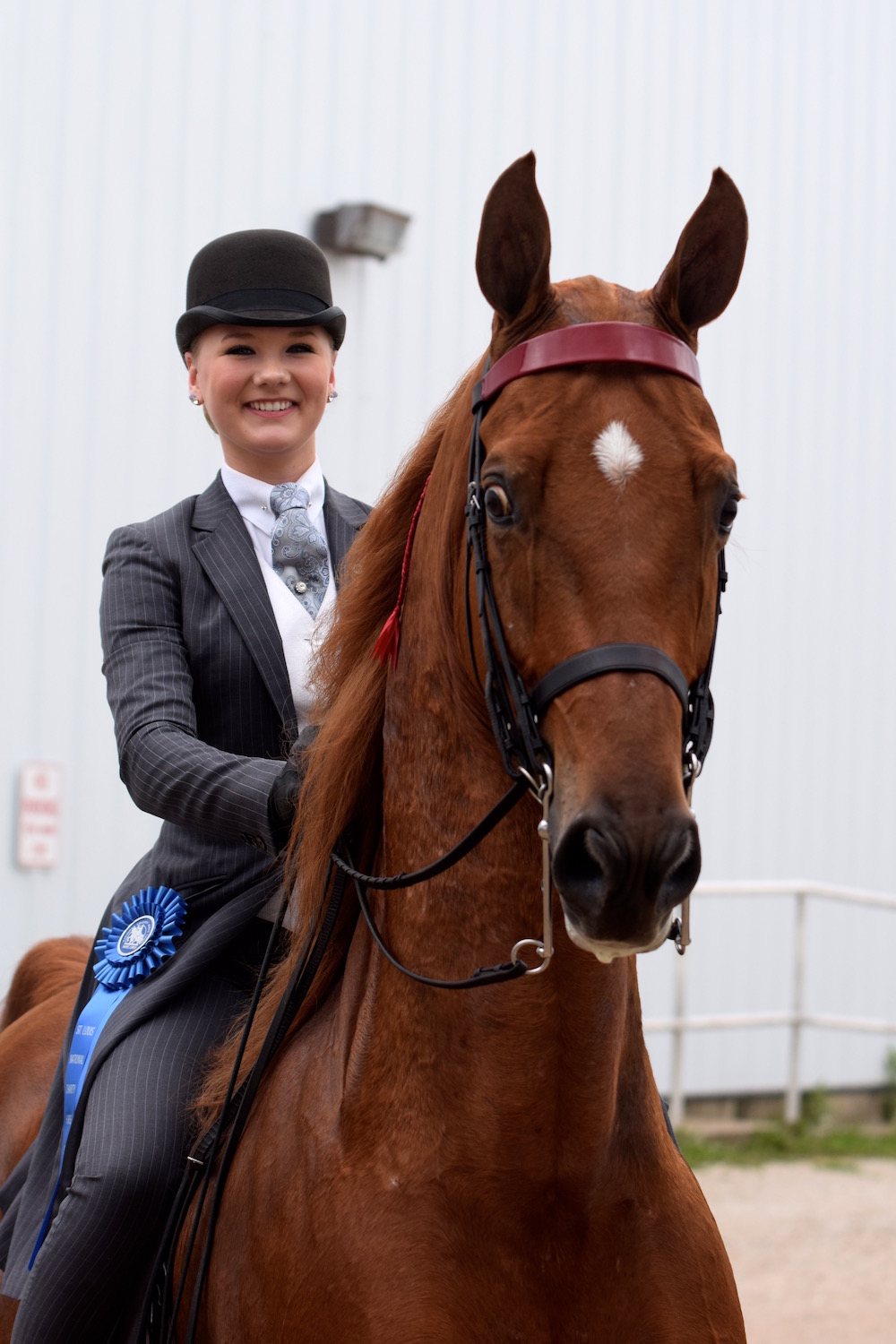 Haley Berget after a winning catch-ride aboard CH Highly Caffeinated.